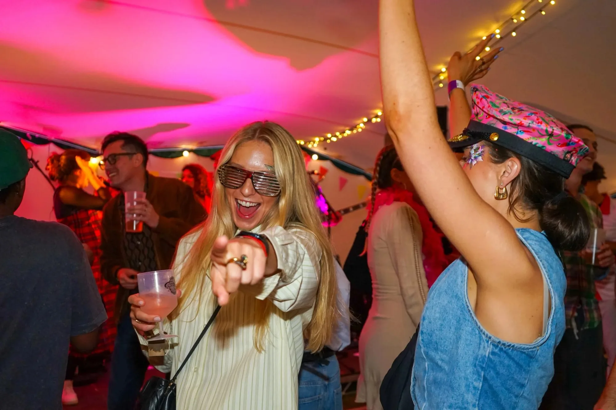 A corporate party under colourful lights